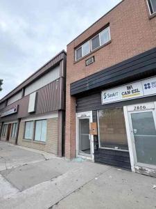a store front of a brick building with its door open at 2806 Regina in Regina