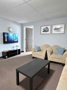 a living room with a couch and a coffee table at 2806 Regina in Regina