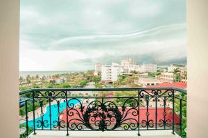 a view of a city from a balcony at Khách sạn Chinh Thuỷ in Sầm Sơn