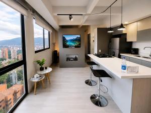 an open kitchen with a view of a city at Lovely Private Apto in Poblado in Medellín