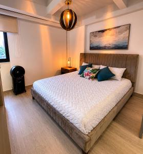 a bedroom with a large bed in a room at Lovely Private Apto in Poblado in Medellín