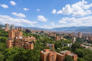 a view of a city with tall buildings and trees at Lovely Private Apto in Poblado in Medellín