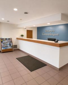 a lobby of a convenience store with a counter at Super 8 by Wyndham Canandaigua in Canandaigua