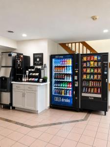 a store with two vending machines and soda machines at Super 8 by Wyndham Canandaigua in Canandaigua