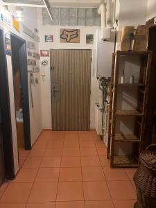 a hallway with a door in a room at Druhý domov in Podmokly