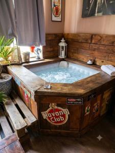 a jacuzzi tub in the middle of a room at Druhý domov in Podmokly