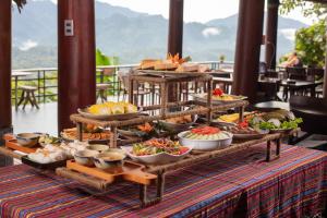 a buffet of food on top of a table at Gateway Inn PuLuong in Pu Luong