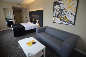 Кровать или кровати в номере Tempo Hotel Caglayan