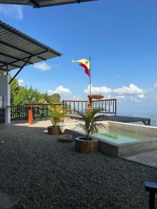 a resort with a pool and the ocean in the background at Las Trincheras del Café in Chaparral