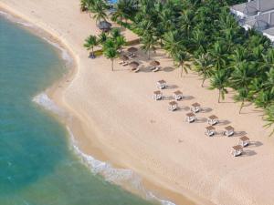 an overhead view of a beach with umbrellas and the ocean at Meliá Vinpearl Phu Quoc in Phú Quốc