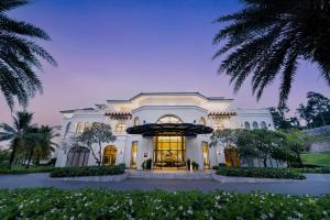 a large white building with its doors open at Meliá Vinpearl Phu Quoc in Phú Quốc