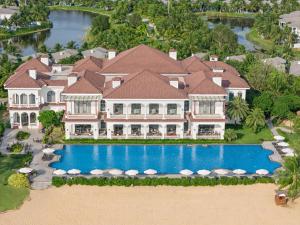 an aerial view of a large house with a swimming pool at Meliá Vinpearl Phu Quoc in Phú Quốc