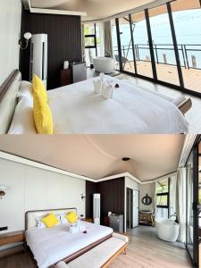 a bedroom with a large white bed and a bathroom at Umbrella tree V4 in Nathon