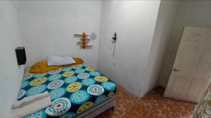 a bedroom with a bed with donuts on it at Habitacion Amatitlan in Amatitlán