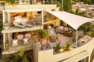 an aerial view of a building with a living room at Hastings Park: Lavish Ocean Vista Luxury in Noosa Heads