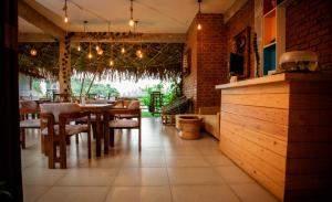 a dining room with a table and some chairs at Ella Dream Mount in Ella