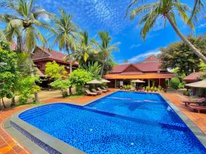 an image of a swimming pool at a resort at ASANA Villas in Siem Reap