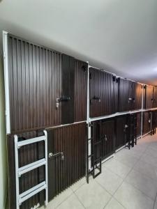 a row of wooden stalls in a building at Capsule CDMX in Mexico City