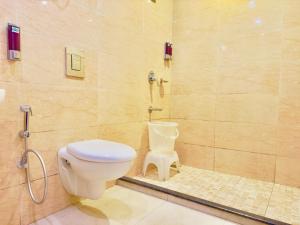a bathroom with a toilet and a shower at The Four Season Resort, Mussoorie - top rated & most awarded property in mussoorie in Mussoorie