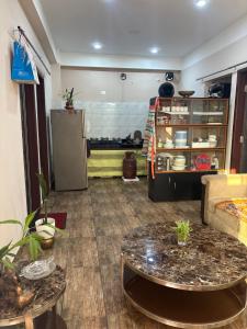a living room with a couch and a table at Haven Stay in Panchanai