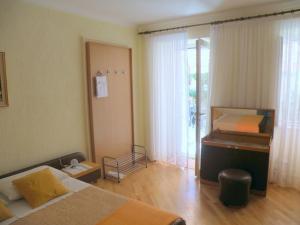 Postel nebo postele na pokoji v ubytování Rooms Alida