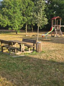a park with a picnic table and a playground at Ferienwohnung Tirolerhof in Horn