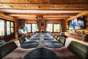 a dining room with a long table and chairs at Casa Di Giorgio in Borsa