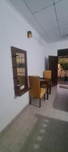 a room with chairs and a table and a window at Ranketha Hideout Resorts in Kurunegala