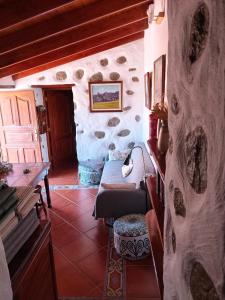 a living room with a couch and a table at Casita Bentayga in Tejeda