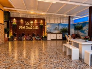 a restaurant with bikes parked on a wall in a room at Pool Smile Villa in Bangsaen +24 photos