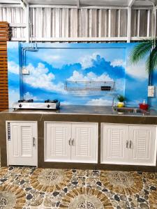a kitchen with a large fish tank at Pool Smile Villa in Bangsaen