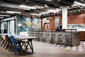a conference room with a table and stools at Generator Stockholm in Stockholm