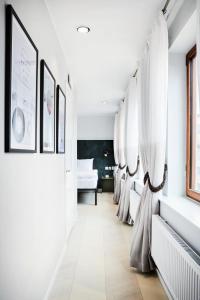 a row of beds in a room with white walls at Generator Stockholm in Stockholm