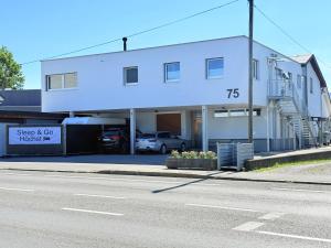 a white building on the side of a street at Sleep & Go Höchst in Höchst
