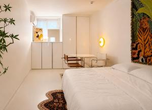 a bedroom with a bed and a table in it at TOV stay in Seoul