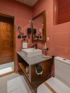 a bathroom with a sink and a mirror at Villa Cavo - Beneath the Misty Peaks in Haputale +95 photos