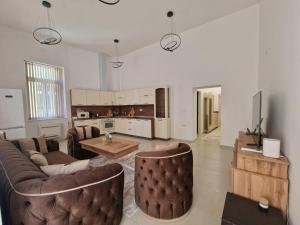 a living room with a couch and a table at Elena Apartments in Absolute Center in Ruse