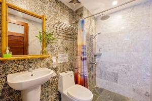 a bathroom with a toilet and a sink and a shower at Calm House 4 Hoi An in Hoi An