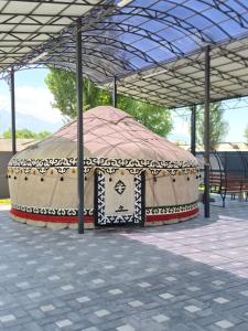 a large tent is sitting under a roof at TOI AT-BASHY HOTEl in At-Bashy