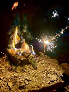a fire pit with sparklers on top of it at 民宿 浪漫 in Fujikawaguchiko