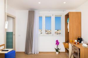 a living room with a desk and a window at Le 3 Viste B&B in Vieste +34 photos