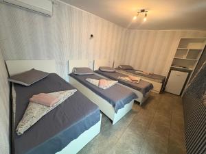 a room with two beds in it with at Amalya in Constanţa