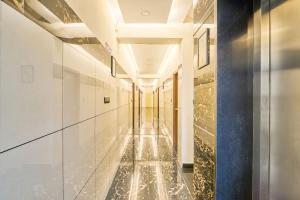 a long hallway with water in a building at Itsy Hotels NRM Residency - Near Mysore Palace in Mysore
