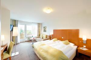 Postel nebo postele na pokoji v ubytování Hotel Walkner