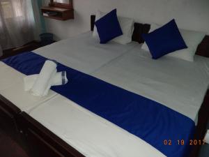 Postel nebo postele na pokoji v ubytování Raja174 Homestay