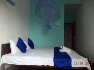 Postel nebo postele na pokoji v ubytování Raja174 Homestay
