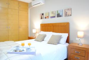 Säng eller sängar i ett rum på Malaga Center Flat Holidays Paseo de Reding