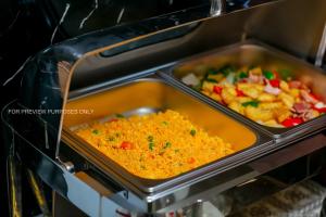 two trays of food in a toaster oven at Downtown Hostel HANOI & HA GIANG LOOP TOUR OFFICE in Hanoi