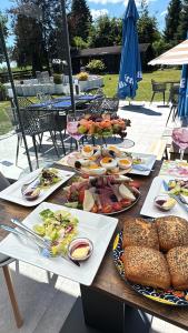 a table with many plates of food on it at Villa Johannes in Warmensteinach