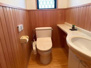 a bathroom with a toilet and a sink at Anan Seaside House in Anan +12 photos